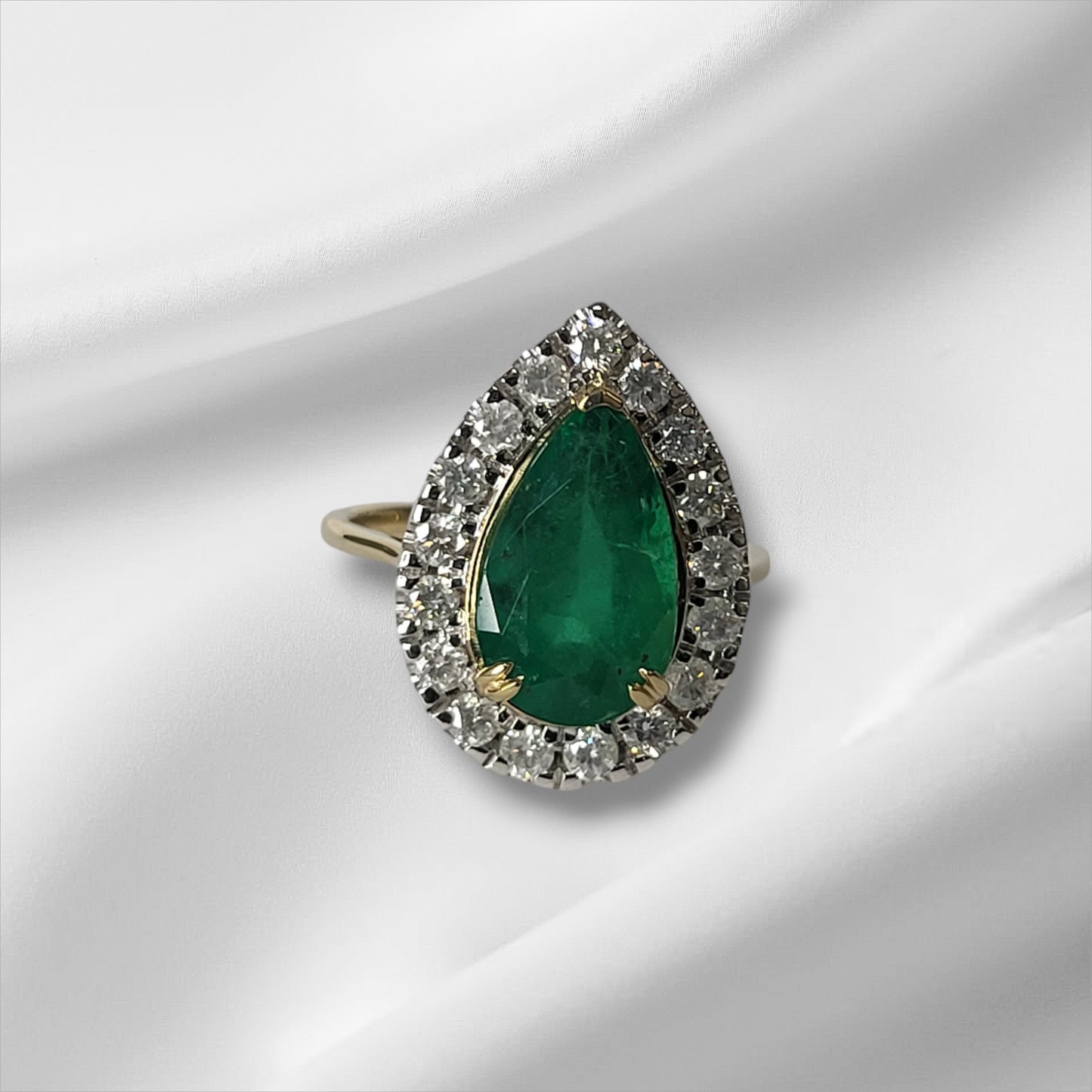 Pear Cut Emerald and Diamond Halo Ring