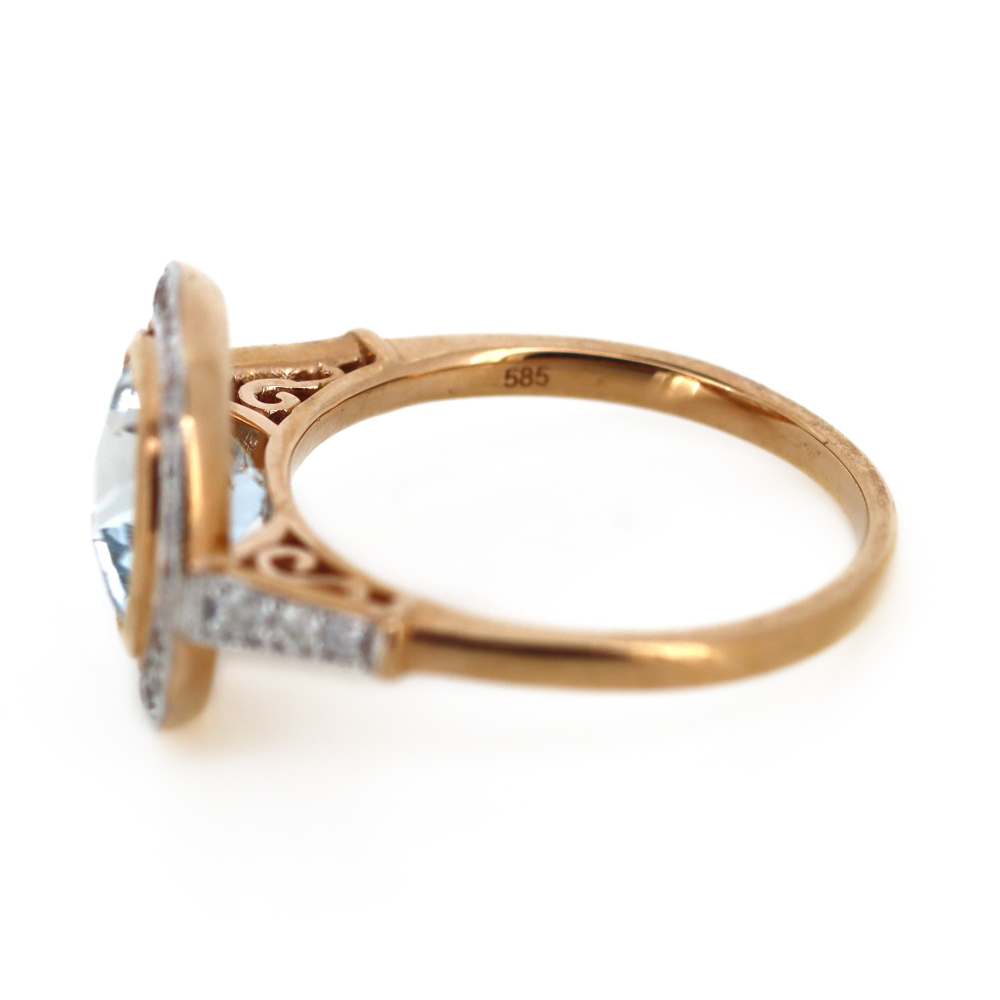 Rose Gold Aquamarine and Diamond Halo Ring