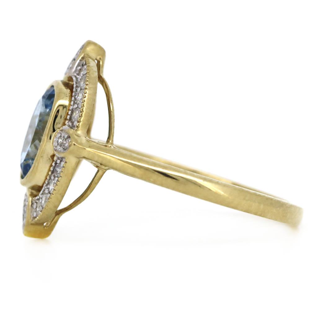 1.06ct Yellow Gold Aquamarine and Diamond Halo Dress Ring